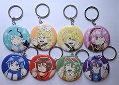 six keychains with cartoon characters on them, all in different colors and sizes