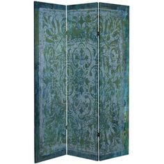 a room divider with an ornate design on the top and bottom panel, in green