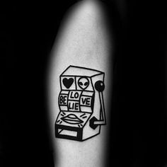 a black and white photo of a tattoo on the arm