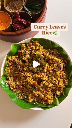 curry leaves rice in a bowl with spices on the side