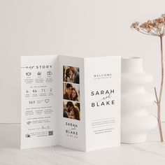 an open brochure with photos on it next to a white vase and flower