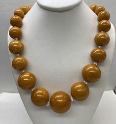 "Beautiful Antique Art Deco Marbled Bakelite Yellow Butterscotch Round Graduated Bead Necklace and past the test good pre/owned condition measures 26\" length and weight 71 grams perfect to add in your collection." Vintage Faceted Round Beads, Vintage Round Faceted Beads, Vintage Amber Jewelry With Large Beads, Classic Yellow Round Bead Jewelry, Amber Round Beaded Jewelry, Round Amber Jewelry With Large Beads, Amber Jewelry With Large Round Beads, Amber Jewelry With Large Beads, Handmade Retro Necklace