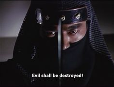 a man in a black outfit with the caption evil shall be destroyed