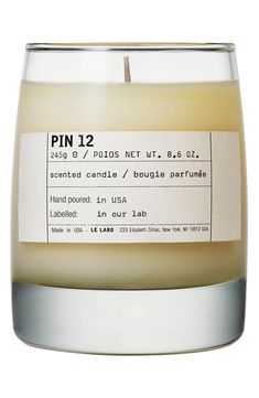 a candle that is sitting in front of a white background with the words pin 12 on it