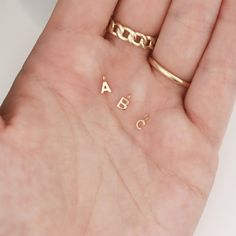 Our 14K Solid Gold Initial Letter Charms for permanent jewelry are the perfect addition to your permanent jewelry charm collection! These dainty solid gold charms are a great way to add more value and customization to your permanent jewelry business! #permanentjewelry #14kgold #14kgoldcharms #initialcharms #goldinitialcharms #lettercharms #bulkcharms #jewelrymaking #permanentjewelrybusiness #solidgoldcharms #permanentjewelryideas Gold Jewelry Making, Jewelry Chains, Solid Gold Charms, Permanent Jewelry, Sterling Silver Initial, Girly Gifts, Jewelry Website, Letter Charm, Monogram Jewelry