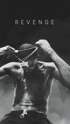 a black and white photo of a shirtless man with his hands on his head