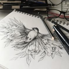 a pencil drawing of a bird with flowers on it's back and two glasses next to it