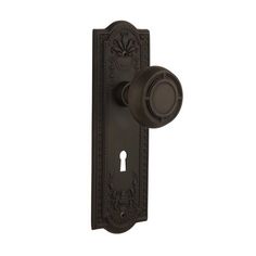 an ornate door handle with a keyhole on the front and back side of it