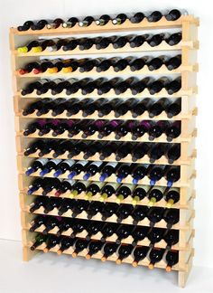 a wooden wine rack filled with lots of bottles