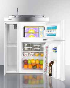 an open refrigerator filled with lots of different types of fruit and drinks in it's door