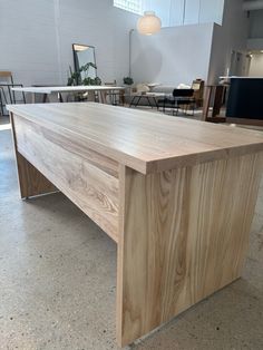 a large wooden table sitting in the middle of a room