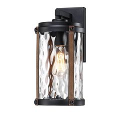 an outdoor wall light with a clear glass and wood frame on the front, against a white background