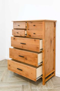 a wooden dresser sitting on top of a hard wood floor