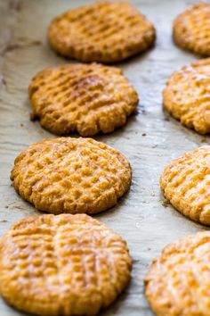 freshly baked cookies are lined up on a baking sheet