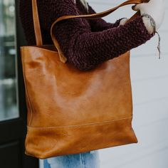 At first glance, you’ll notice the Madison Totes are a work of art. Now whether you choose full leather or waxed canvas is up to you, but as we like to say: “Either choice is the right choice.” But upon closer inspection you’ll realize the true genius to these totes – they are organizational wonders. The Madison Totes are designed with interior pockets to keep your important items separate and safe. There’s an open pocket for your cell phone, two pen slots, and two additional larger pockets for Brown Bags For Fall, Brown Smooth Grain Bags For Fall, Cognac Hobo Bag With Smooth Grain For Everyday, Brown Tote Saddle Bag For Errands, Brown Saddle Tote Bag For Errands, Brown Smooth Grain Hobo Bag For Shopping, Brown Double Handle Hobo Bag With Smooth Grain, Everyday Saddle Bags With Leather Handles, Brown Saddle Bag For Daily Use In Fall