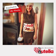 a woman standing in front of a wall with nutella on it's chest