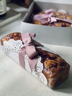 two pieces of bread wrapped in pink ribbon