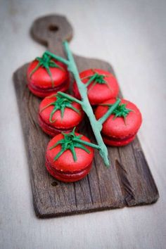 small red tomatoes on a wooden cutting board