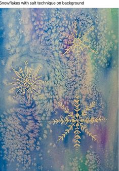 snowflakes with salt technique on background in blue, green and yellow hues