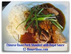 chinese roast pork shoulder with royal sauce and white rice on a plate in the foreground