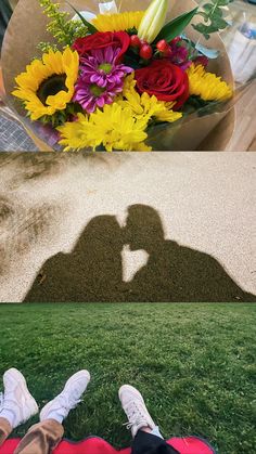 two people sitting in the grass with their shadow on the ground and flowers behind them