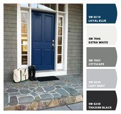 a blue front door with white trim and black accents