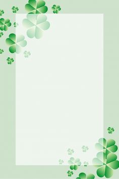 four leaf clovers on a light green background with space for your text or image