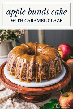 an apple bundt cake with caramel glaze is on a white platter