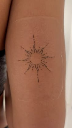 a woman with a tattoo on her thigh