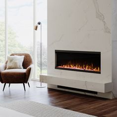 a living room with a chair and a fire place in the fireplace, next to a large window