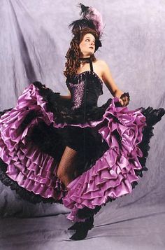 a woman in a purple and black dress