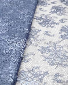 two blue and white lace fabrics