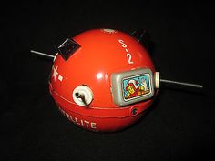 a red radio that is sitting on top of a table