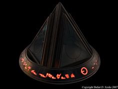 a black object with red lights on it's sides and an upside down triangle in the middle