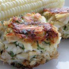 two pieces of food on a plate with corn