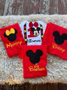 three mickey mouse onesuits are sitting on top of a chair with the name minnie's big brother written on them