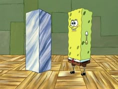 spongebob standing in front of a tall blue box on a wooden floor next to it