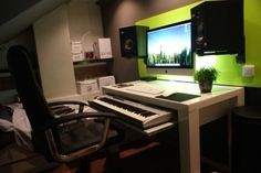 a desktop computer sitting on top of a desk next to a keyboard and monitor in a room