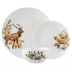 two white dishes with deer designs on them