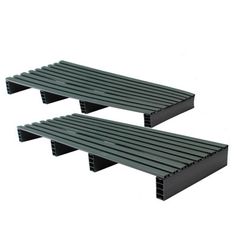 two black plastic shelfs sitting next to each other