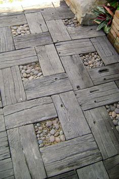 a close up of a wooden floor with rocks and stones on it's sides