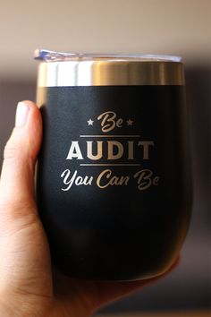 a person holding up a wine glass with the words, be an adult you can be