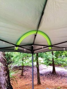 the inside of a tent with trees in the background