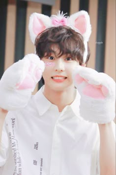 a young man wearing bunny ears and white shirt