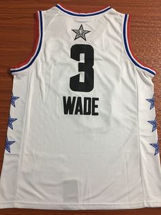 a white basketball jersey with the number 3 wade on it and blue stars around the chest