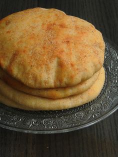 some type of bread on a glass plate