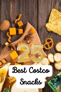 some crackers and cheese on a cutting board with the words 25 best costco snacks