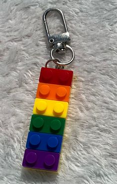 a lego keychain that is made out of legos and has four different colors