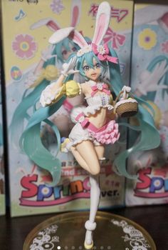 an anime figurine is posed on a table