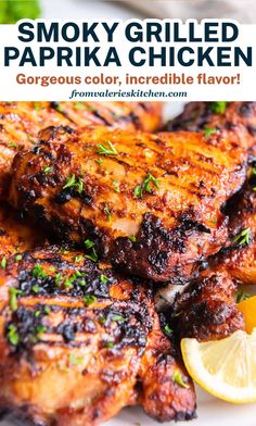 smoky grilled paprika chicken on a plate with lemon wedges